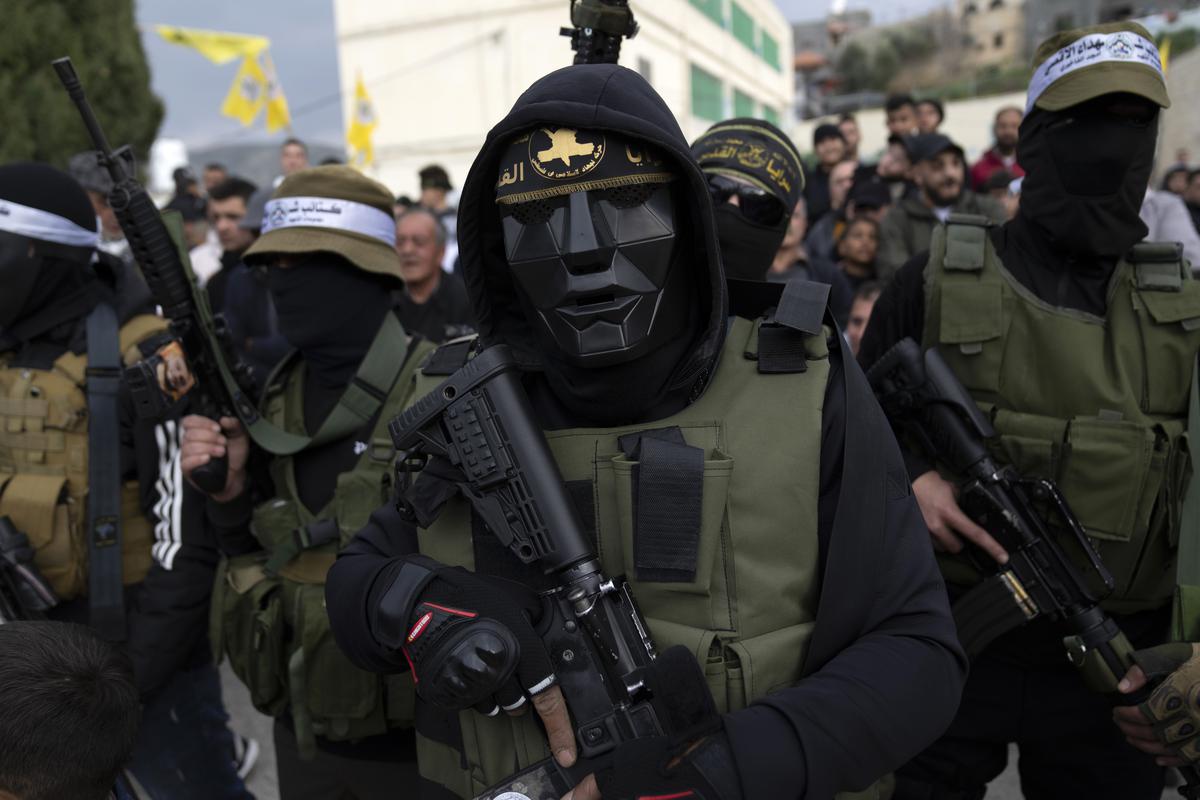 Palestinian militants take part in a military parade.File