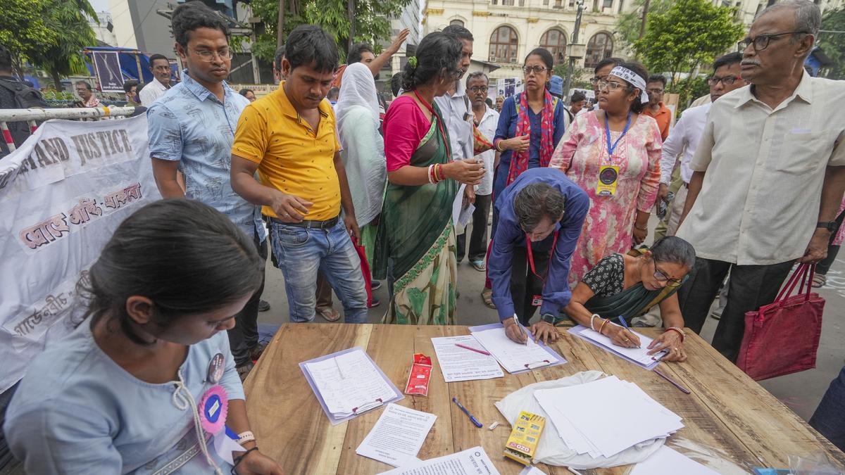 Protesting junior doctors collect signatures from the public in Kolkata