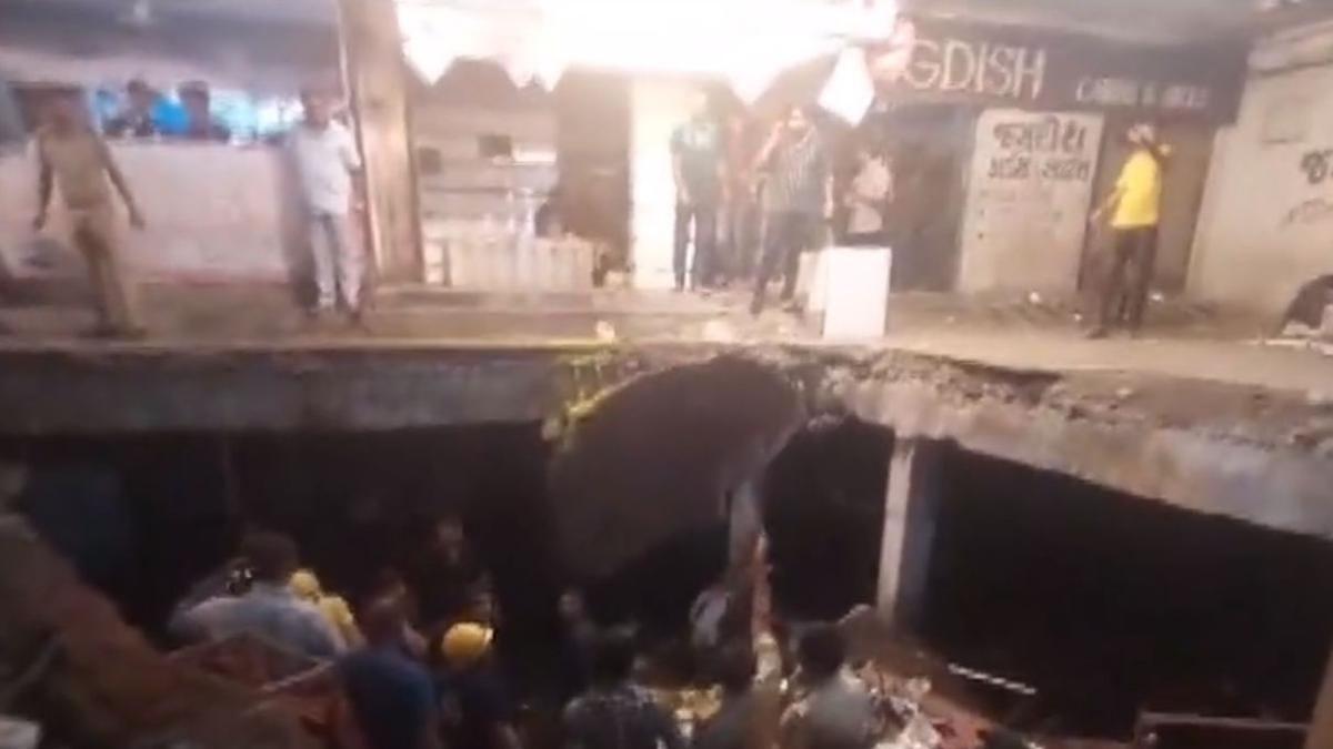 At least 12 injured after drainage slab caves in under weight of crowd in Rajkot