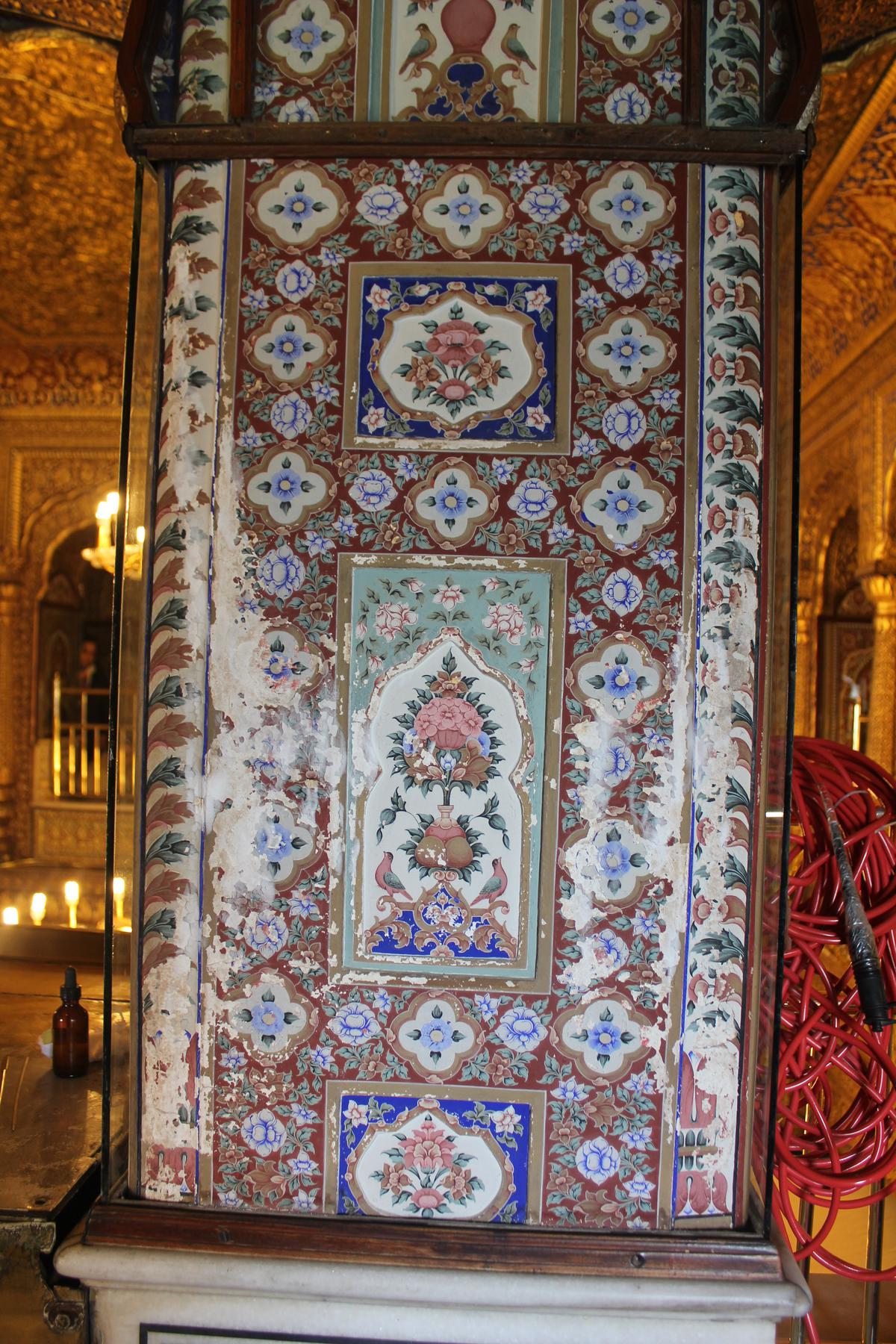 A wall painting at the Golden Temple before conservation. 