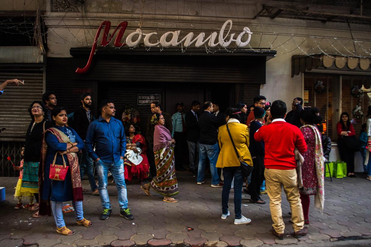 People waited outside a restaurant on 25th December 2018 in Park Street, Kolkata, West Bengal. Park Street is decorated very beautifully with lights every year during Christmas and it attracts a lot of spectators.