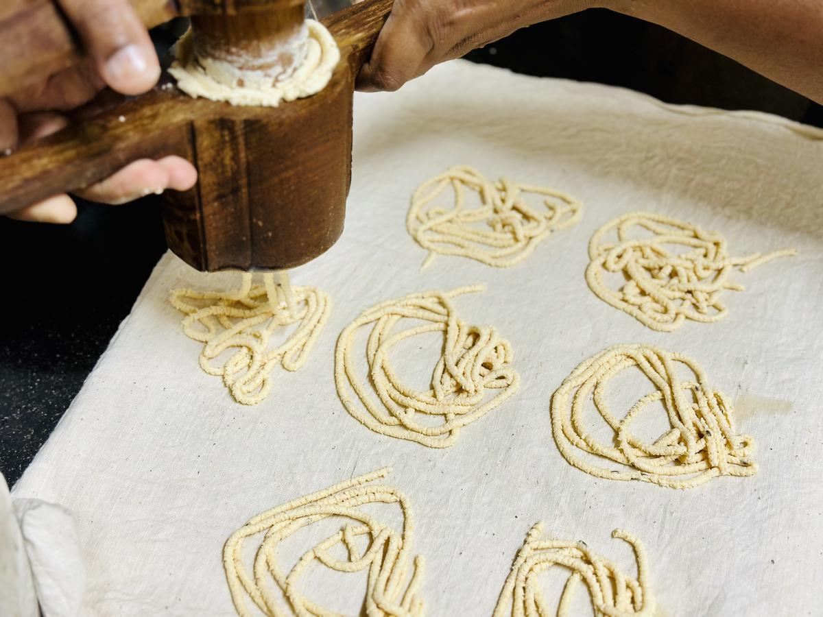 The wooden murukku press from Karaikudi