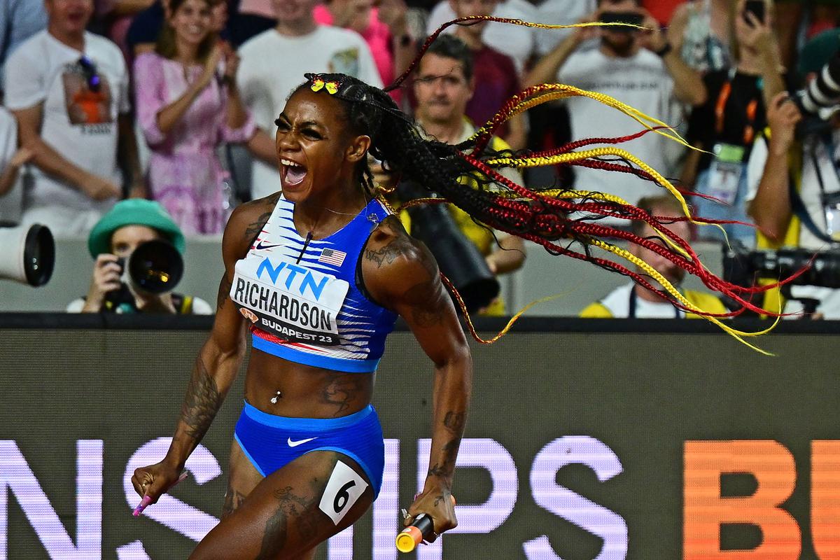 Sha’Carri Richardson celebrates her team’s victory in the women’s 4x100m relay final during the 2023 World Athletics Championships