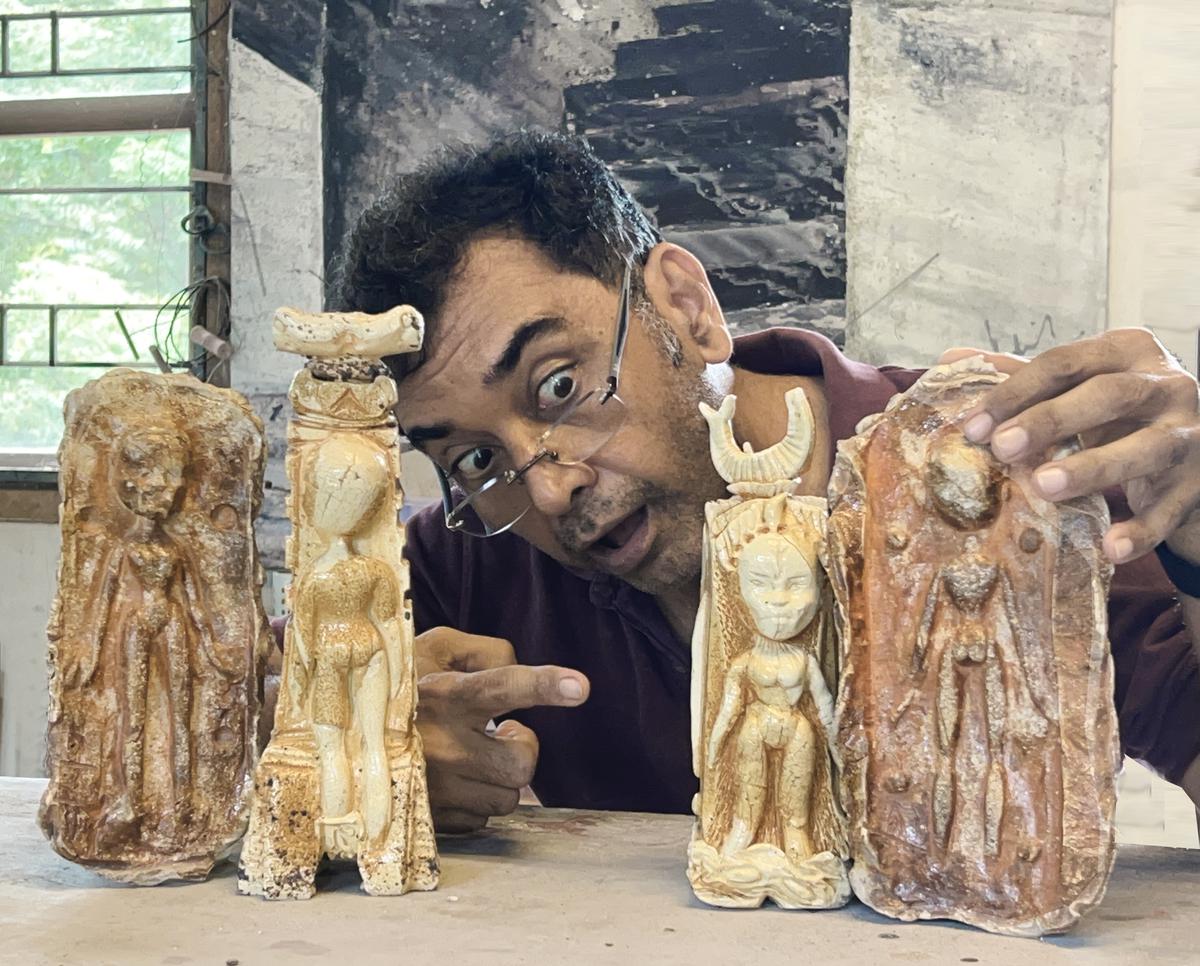 Adil Writer with his clay interpretations