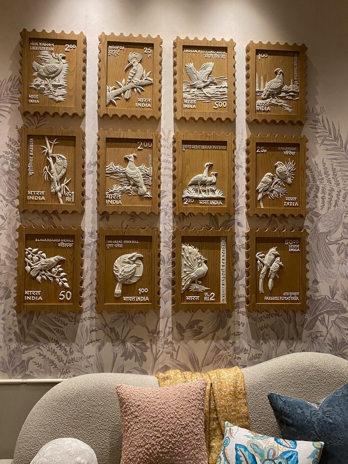 Wall of postage stamp reliefs 