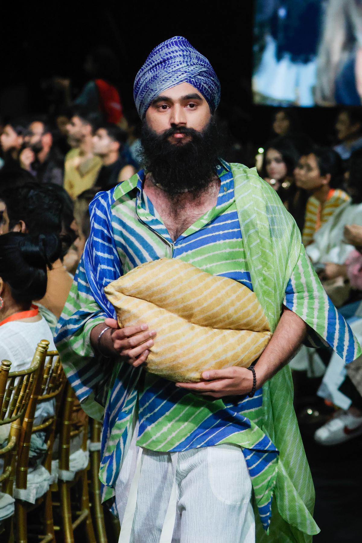 Artist Gurjeet Singh walks the ramp during for Urvashi Kaur at Lakme Fashion Week 2024