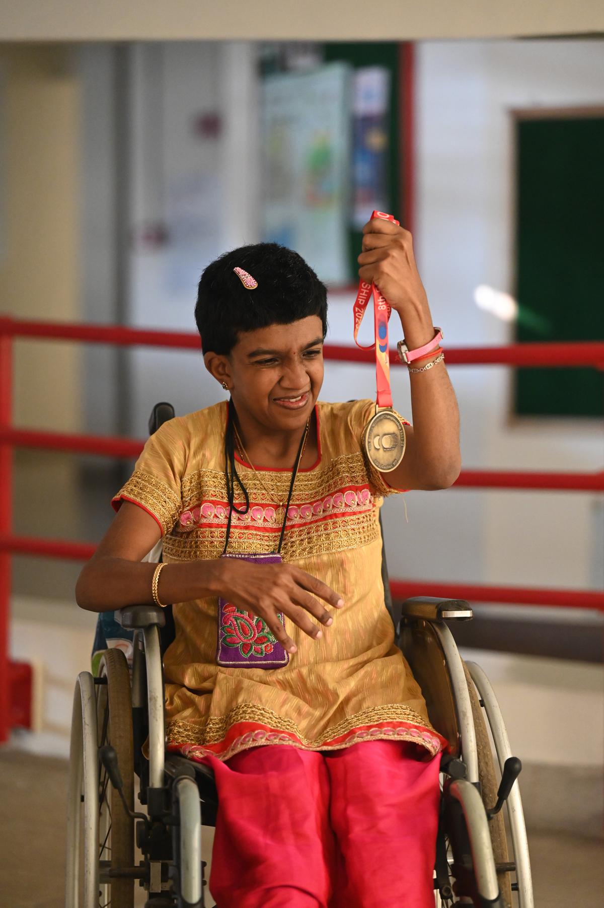 Lakshmi Prabha holds up her gold medal