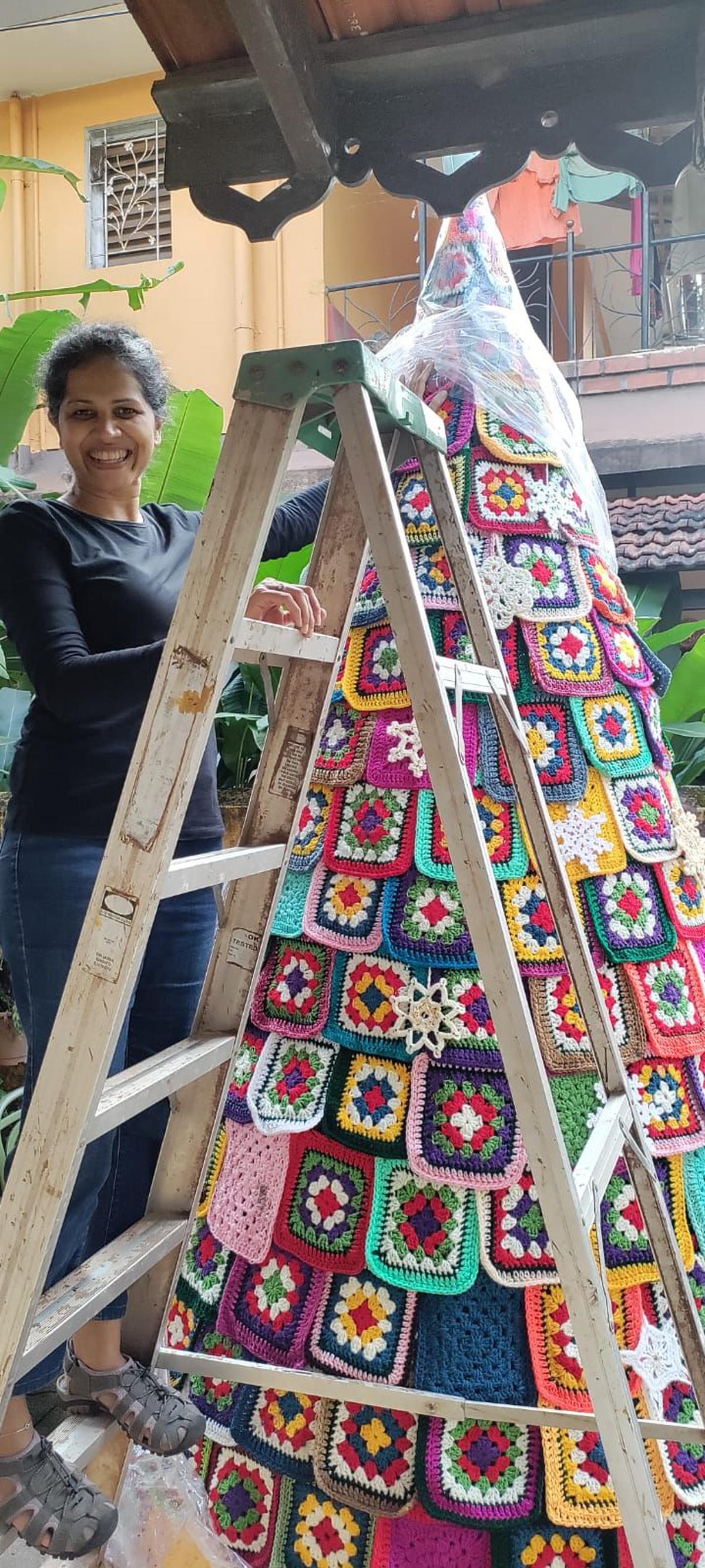 Sheena Pereira, co-founder of the Crochet Collective, attaches each of the 1,000 granny squares for a 3D effect. Sheena Pereira, co-founder of the Crochet Collective, attaches each of the 1,000 granny squares for a 3D effect.