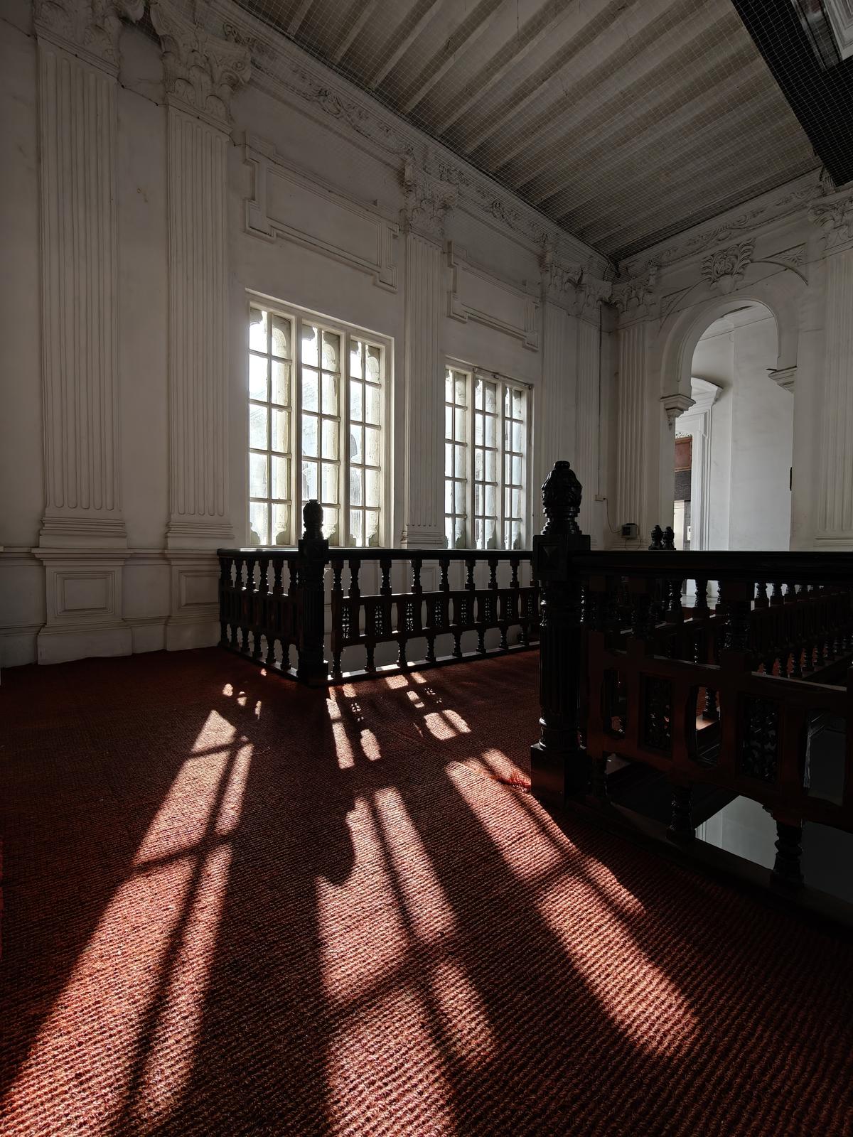 Sunlight filtering in through large panelled windows at the Ripon Buildings 