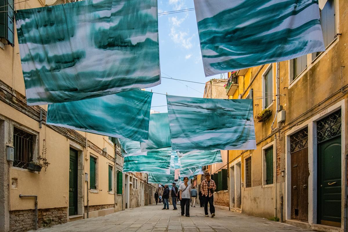 Visitors explore an installation out of the main Biennale areas