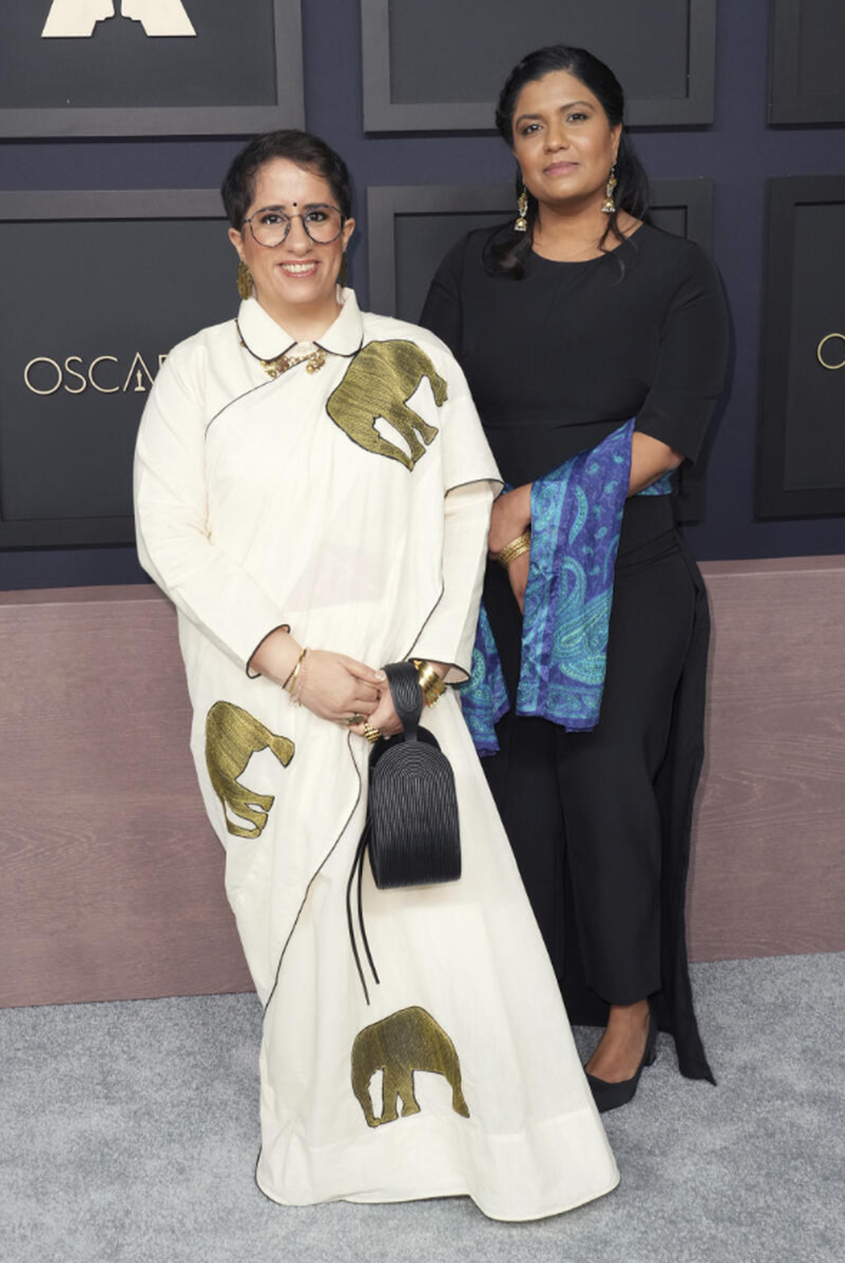 Guneet Monga and (right) Kartiki Gonsalves at the 95th Academy Awards nominees luncheon