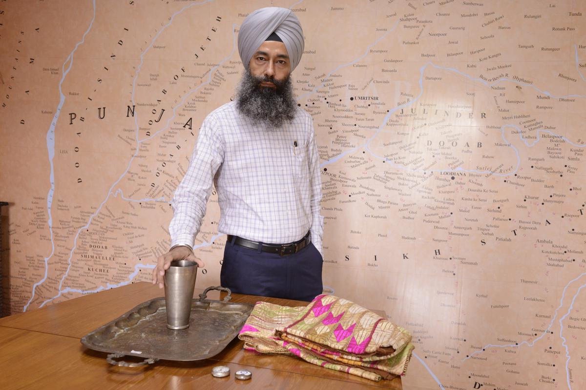 Davinder Singh of PDL with phulkari and utensils brought by his parents during Partition; photo: Sandeep Sahdev