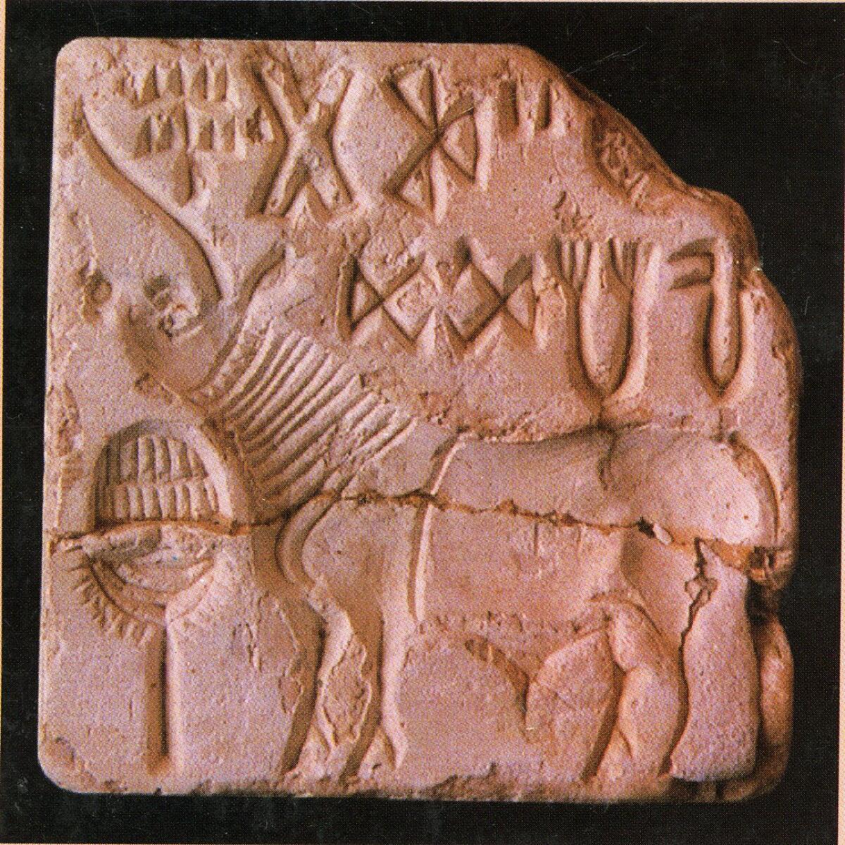 A seal found in Lothal with the carving of a unicorn, and two lines of Harappan signs.