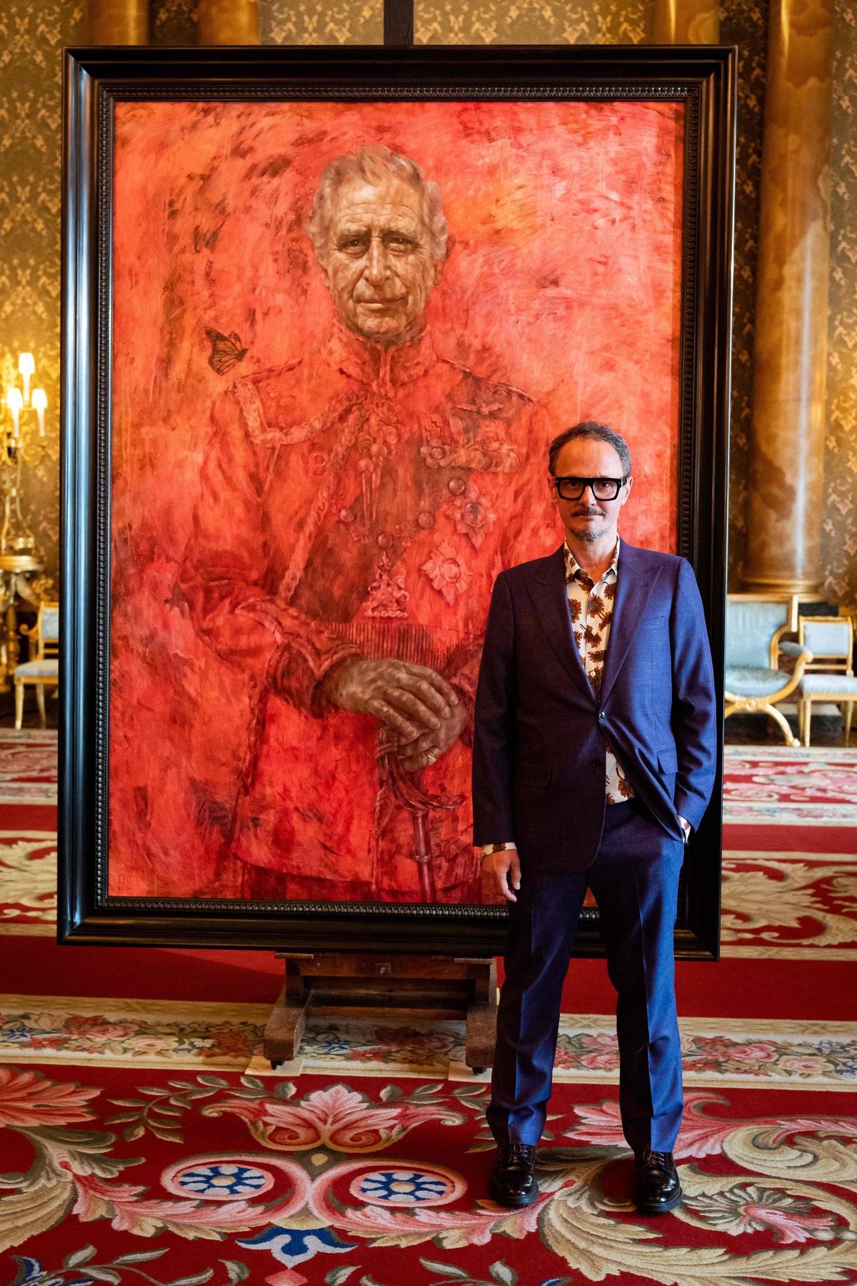 Artist Jonathan Yeo stands in front of his official portrait of Britain’s King Charles III wearing the uniform of the Welsh Guards