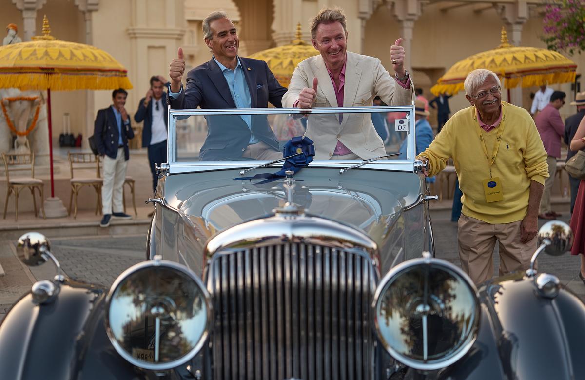 Arjun Oberoi, Executive Chairman The Oberoi Group, Simon Kidston, a judge, and Dhanraj Gidwaney, owner of the Bentley that won the Best of Show prize