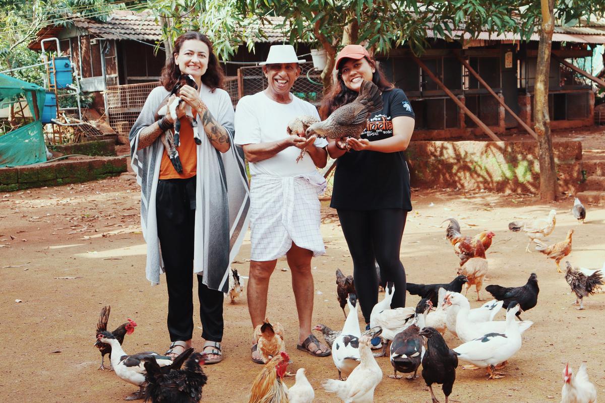 Tourists interacting with locals in Kannur