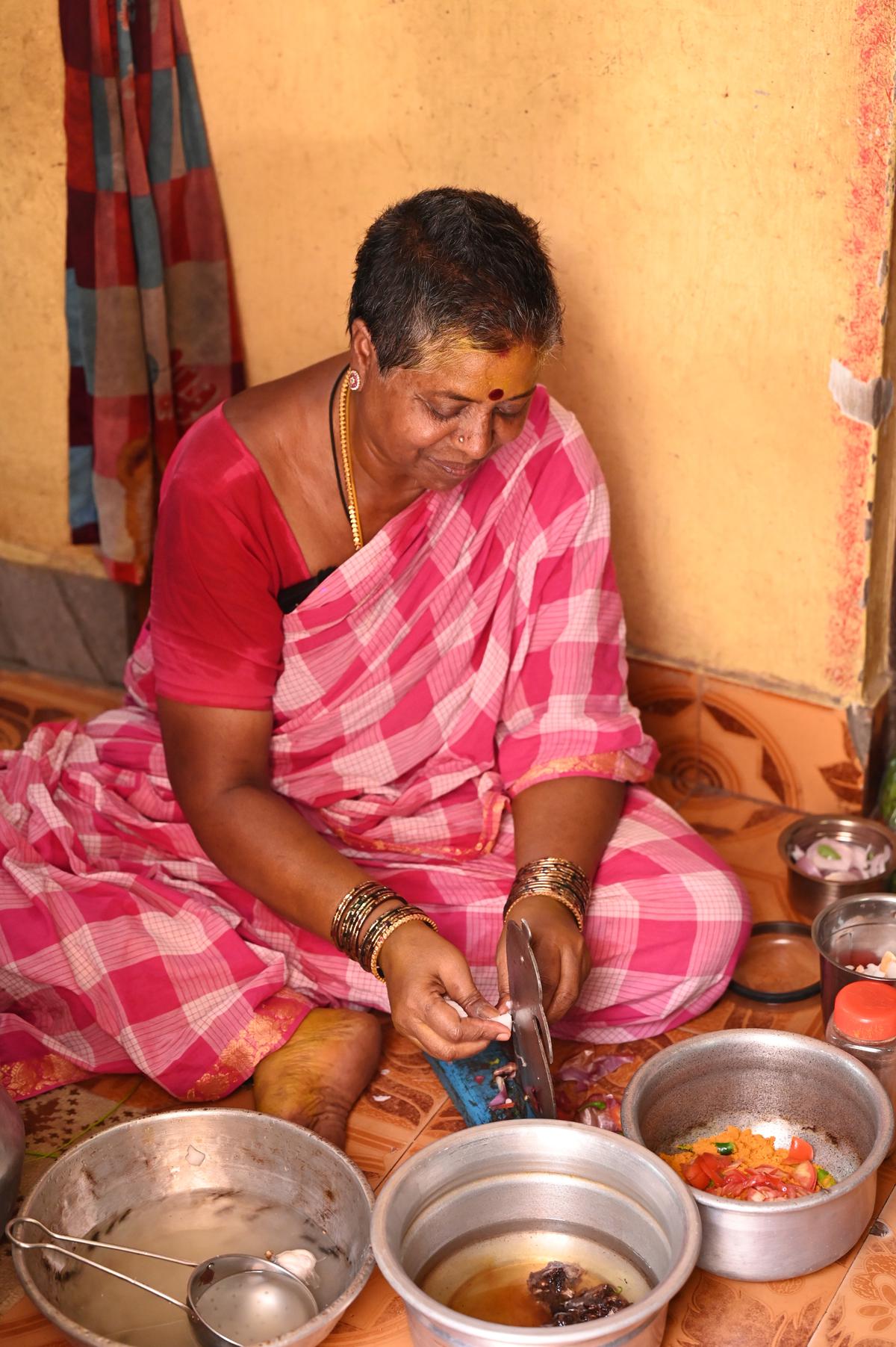 Valli chops onions for the curry