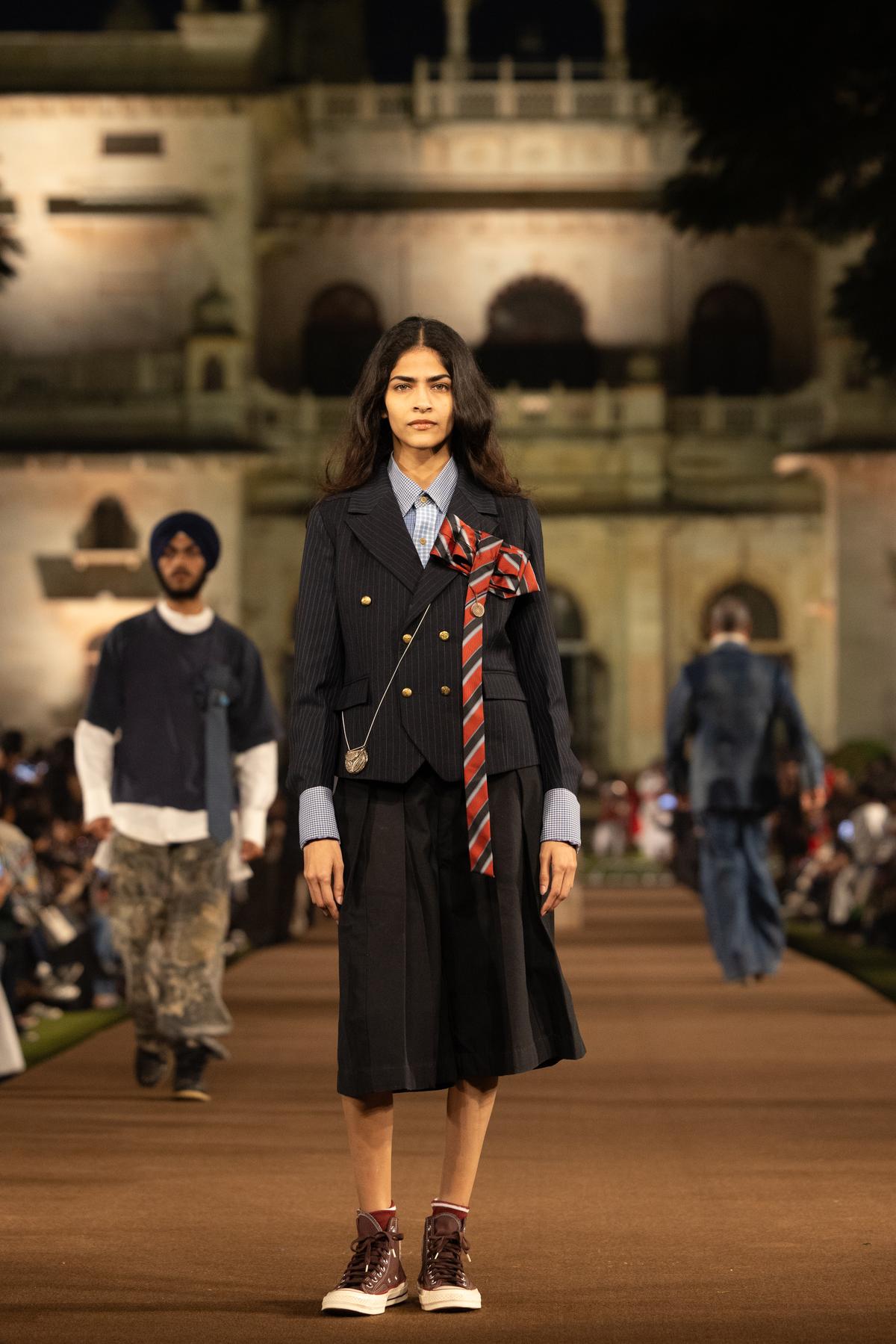 A school tie and antique coin, reimagined as a brooch