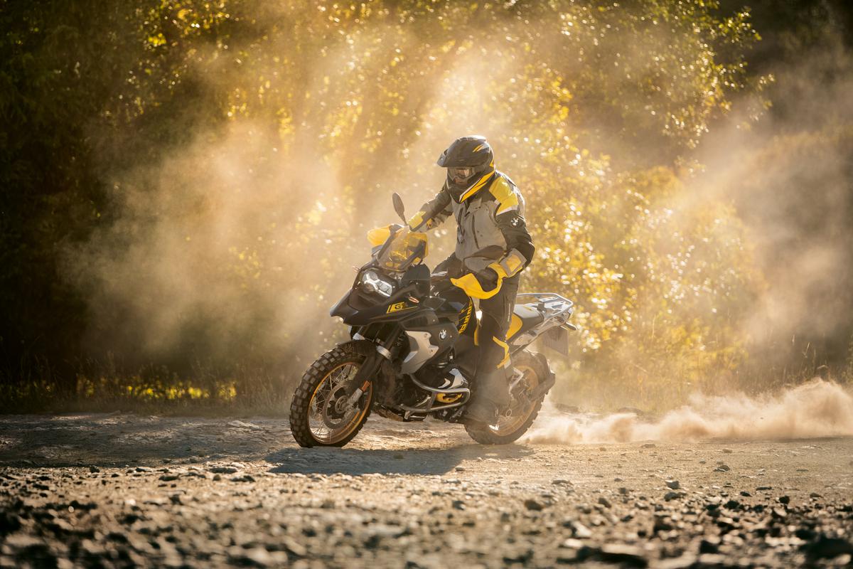 Stuntmen performing drifts on a BMW bike