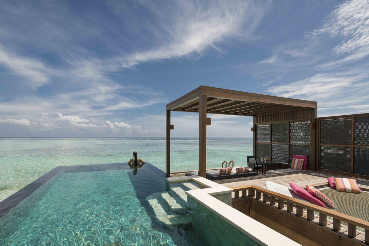 A water villa with private pool at Four Seasons Resort Maldives, Kuda Huraa.  A water villa with private pool at Four Seasons Resort Maldives, Kuda Huraa.