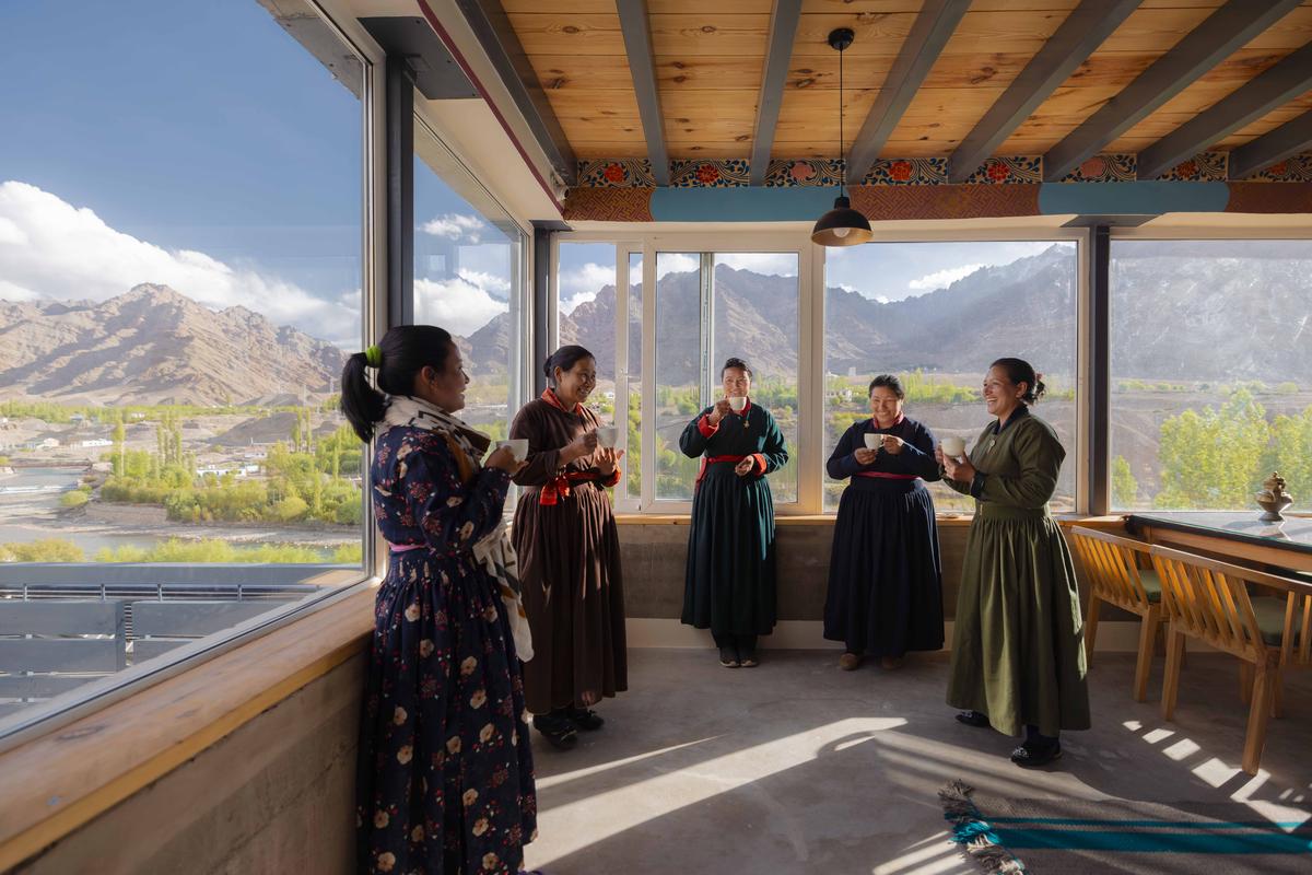 Members of the Women’s Self Help Group of Kharu drinking butter tea at Camp Kharu