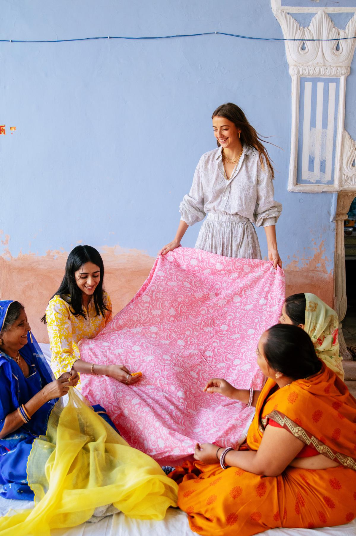 Gauravi Kumari and Claire Deroo with the artisans of PDKF