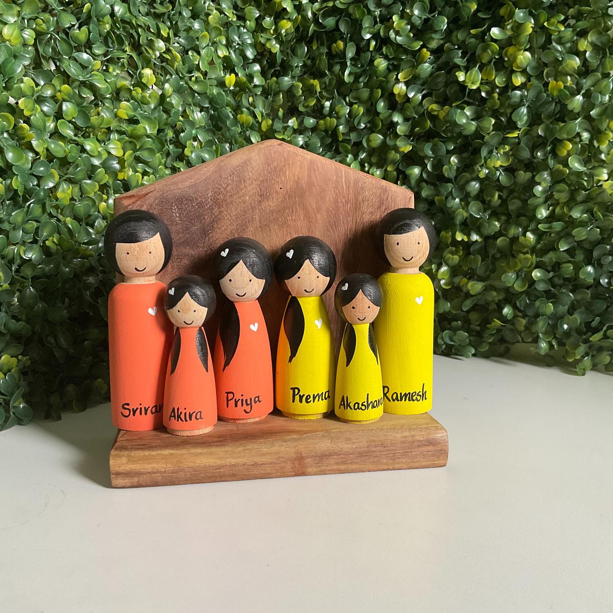 A set of peg dolls crafted in wood by Picky Artz