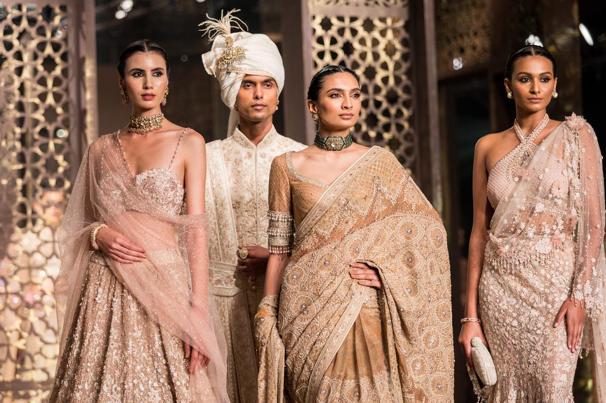 Models sport creations by Tarun Tahiliani