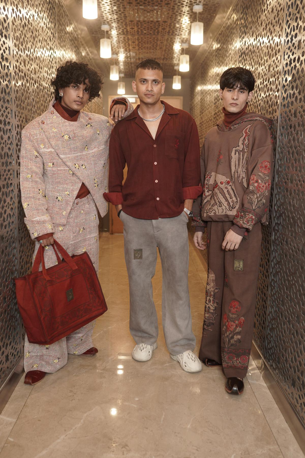 Rishabh Kumar (centre) with the two looks presented at the CDC competition Rishabh Kumar (centre) with the two looks presented at the CDC competition