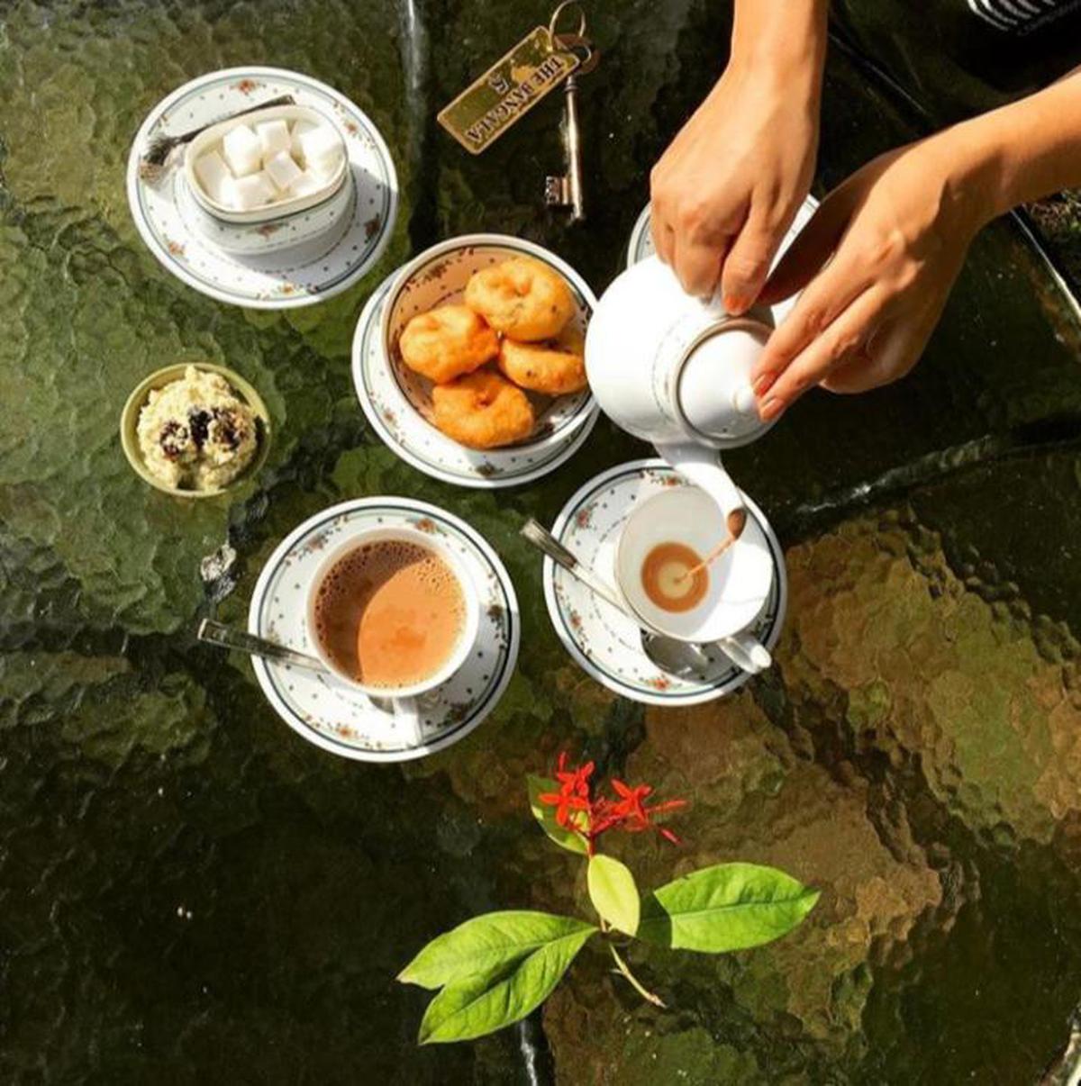 Tea being served with traditional Chettinad snacks at The Bangala