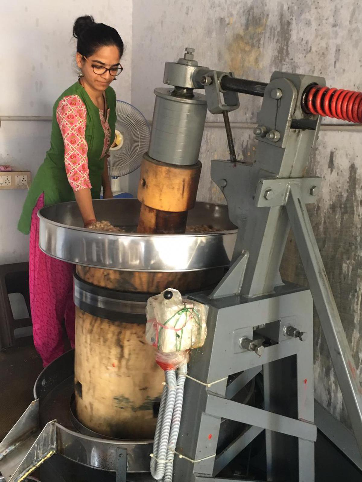 Sharanya Rajendran at her farm’s oil processing unit 