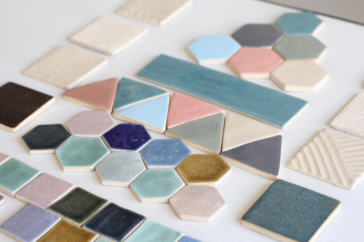 Mosaic tiles can be customised by hand sketching illustrations on them using ceramic colours