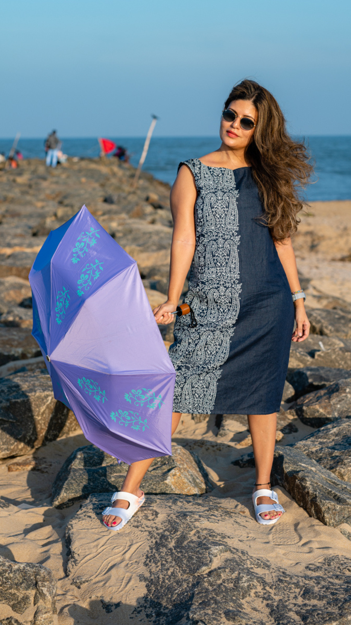 A model sporting Hastha’s hand block printed apparel and umbrella 