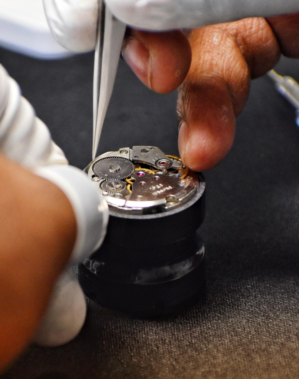 Working on the movement of an HMT watch at the watch-making workshop by Madras Watch Collectors Group