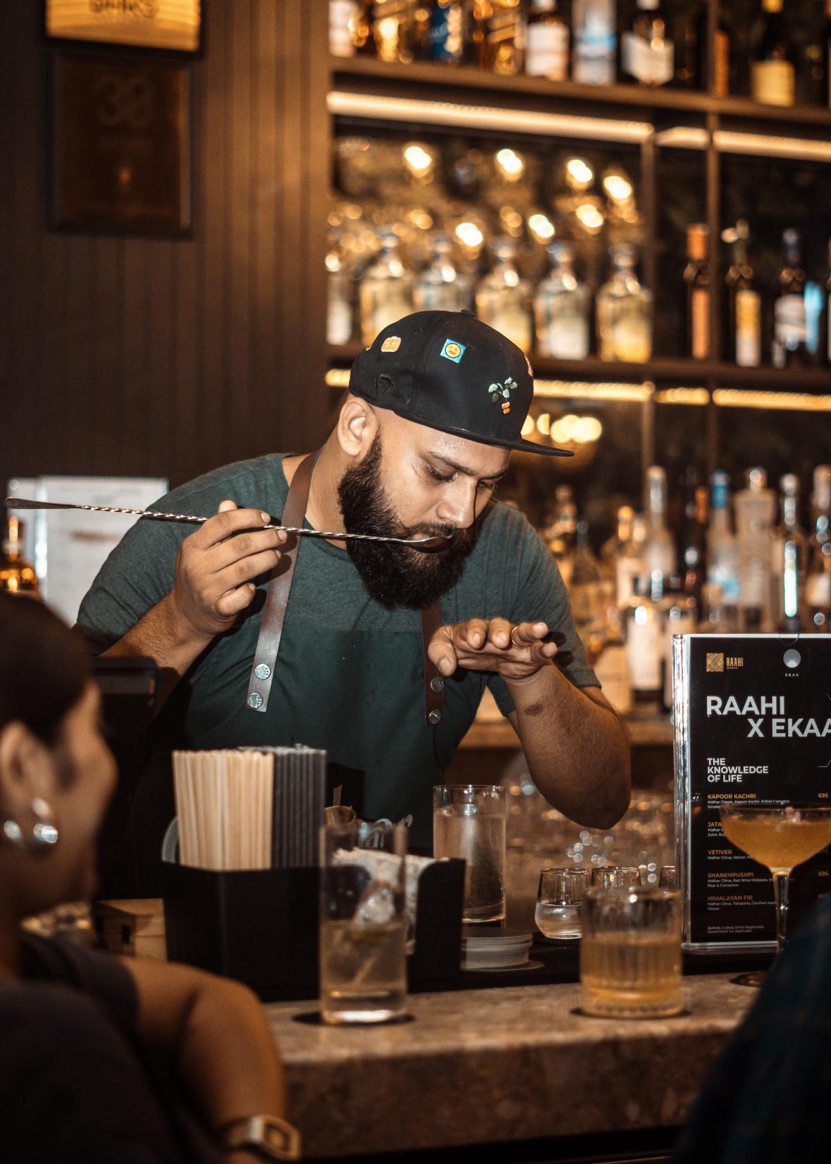 The bartender makes a cocktail at Raahi