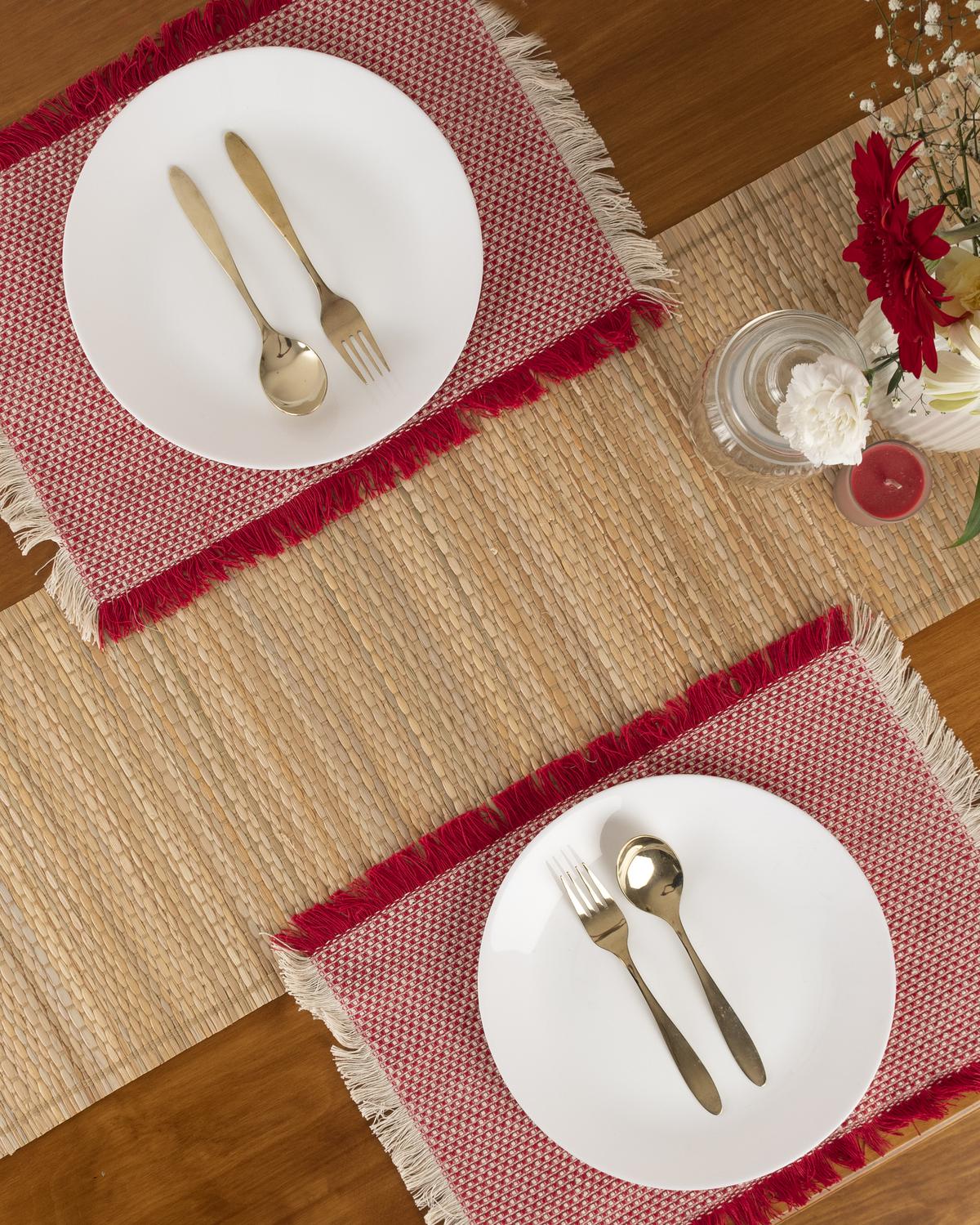 The Yellow Dwelling table linen featuring green woven grass table runner