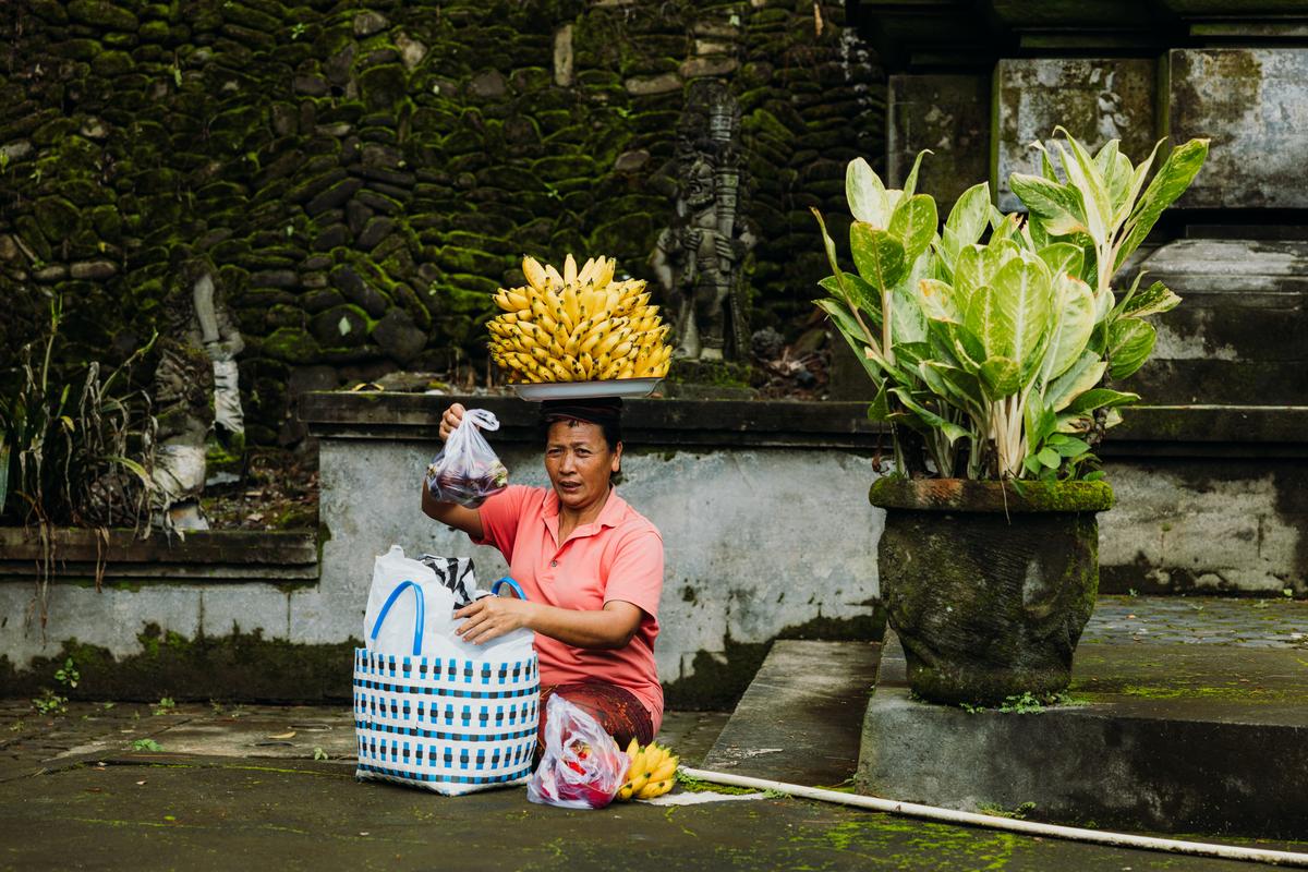 A woman selling bananas in a Balinese temple in Ubud