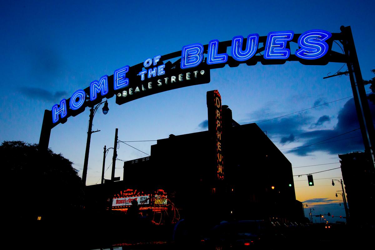 The entrance to Beale street, with neon lit bars boasting live music 