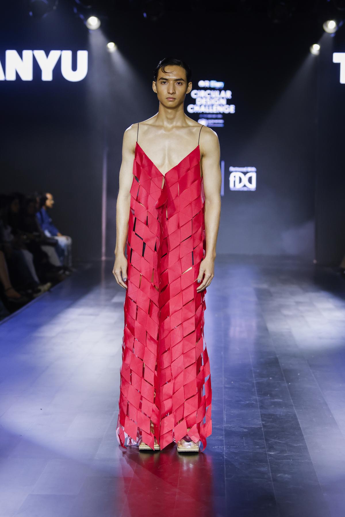 Model walks the ramp during R|Elan Circular Design Challenge 