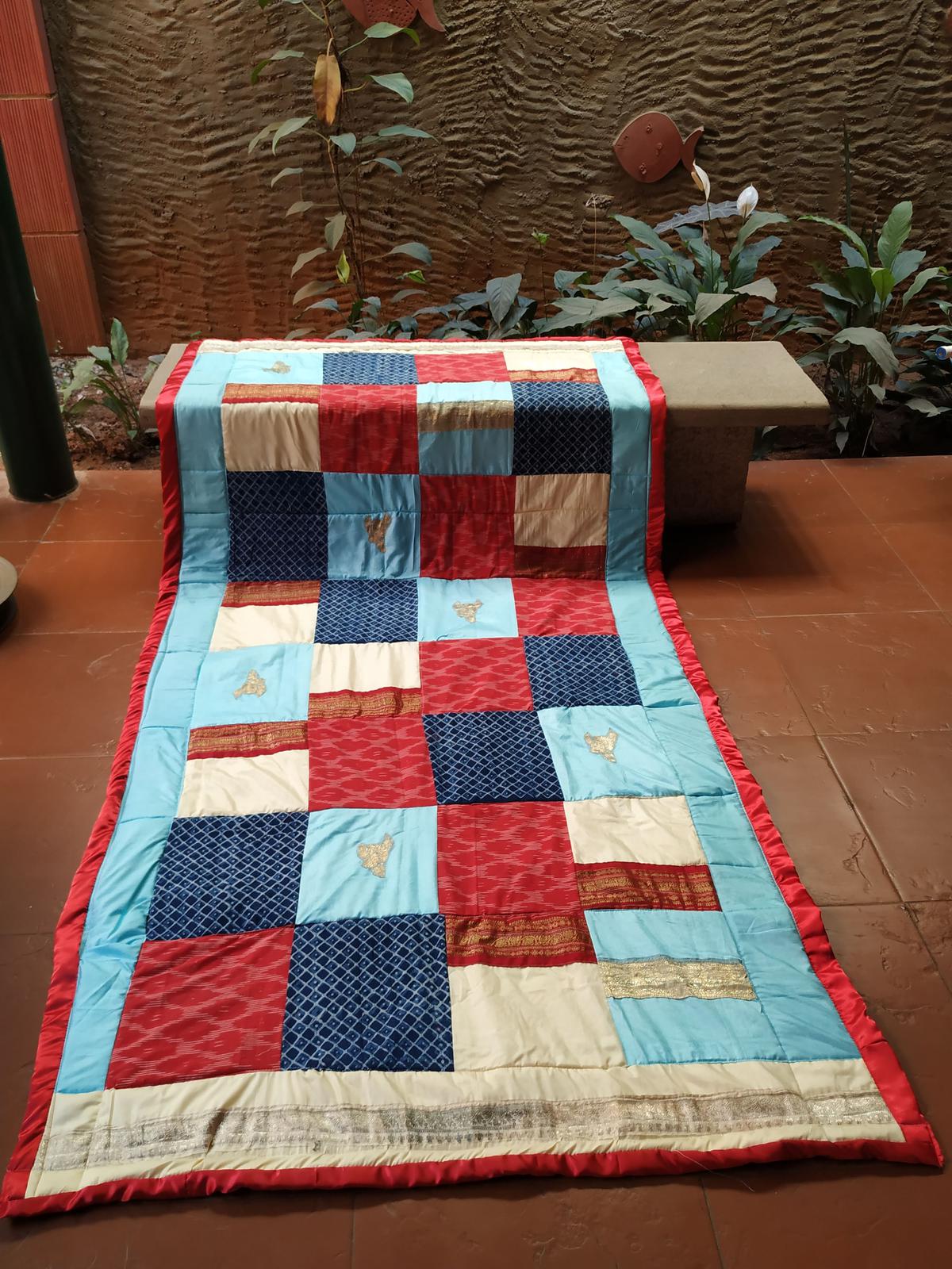 An upcycled quilt by R2 Quilts