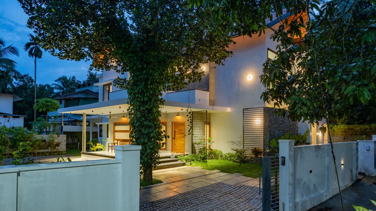 House Beneath a Jackfruit Tree in Kerala features interconnected spaces, jaali work