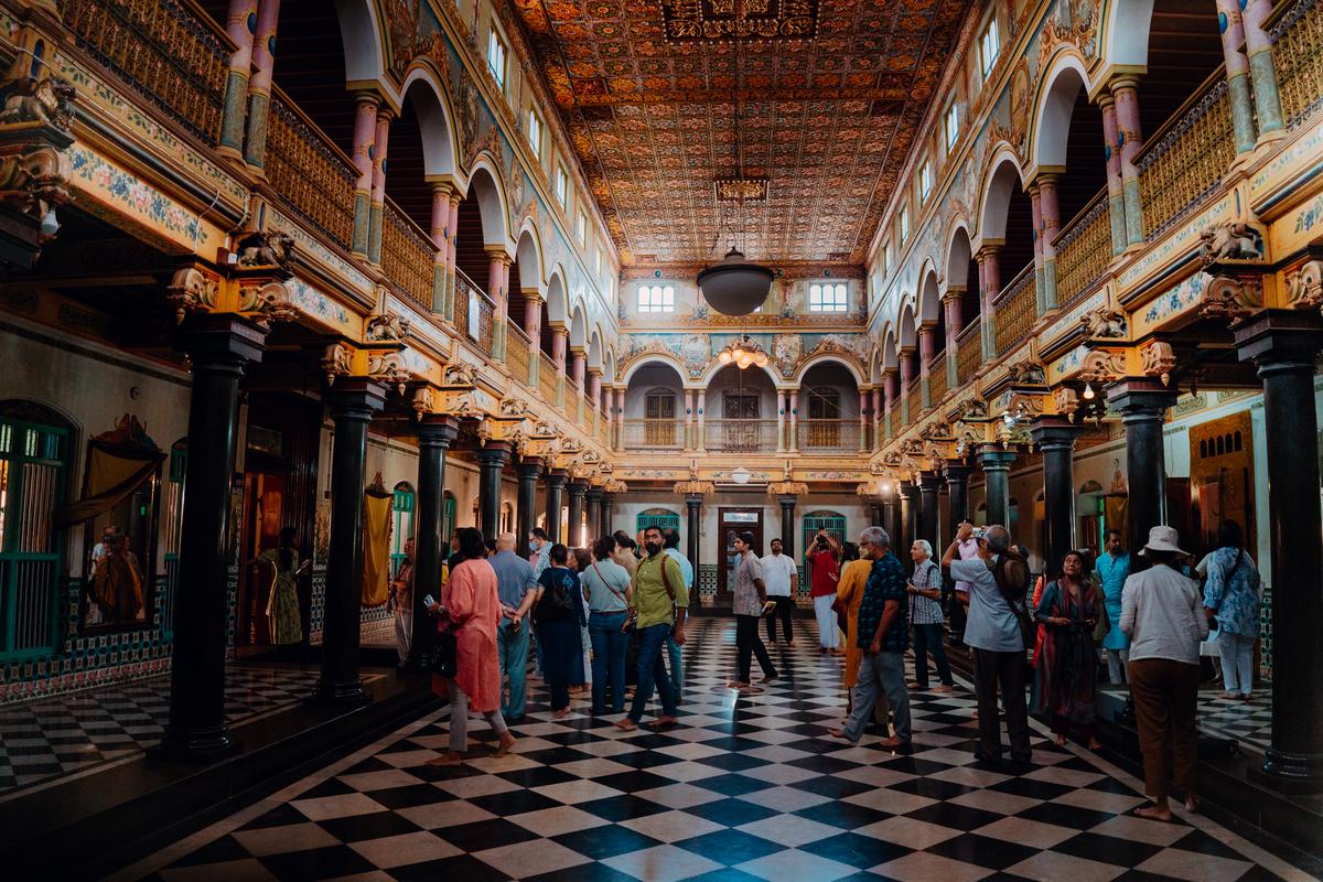 Visitors tour the Athangudi Big House as a part of the Chettinad Heritage and Cultural Festival’s 2022 edition