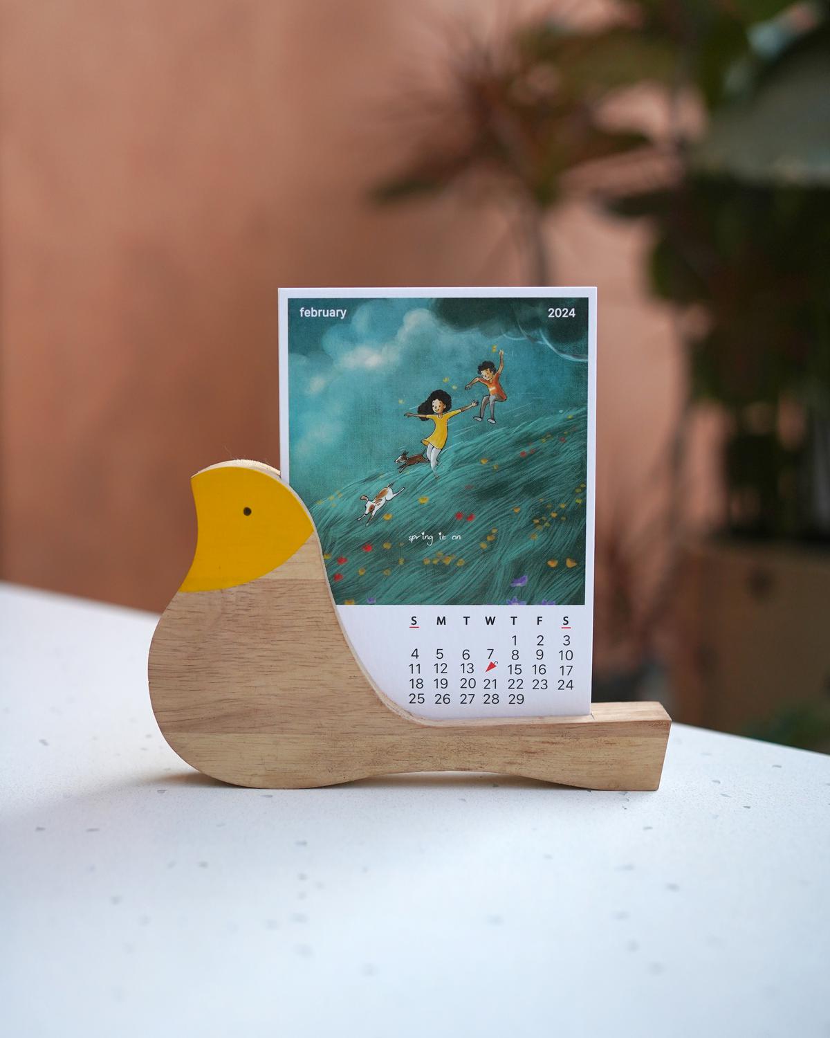 Vimal Chandran’s calendar with the wooden bird stand