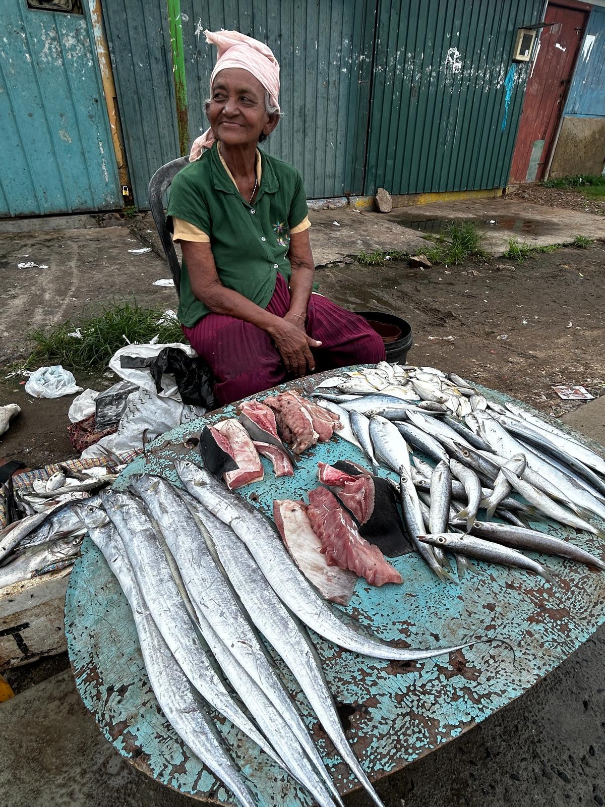 A vendor at a fish market in Negombo, Sri Lanka