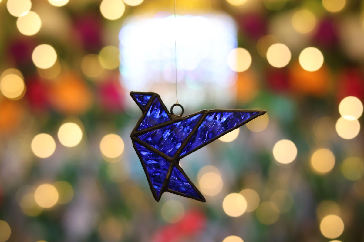 A stained glass ornament crafted at Tanned Ink