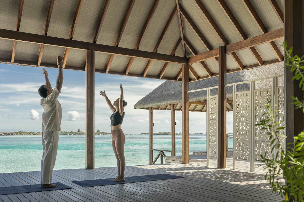Yoga by the beach at The Island Spa, Kuda Huraa Yoga by the beach at The Island Spa, Kuda Huraa