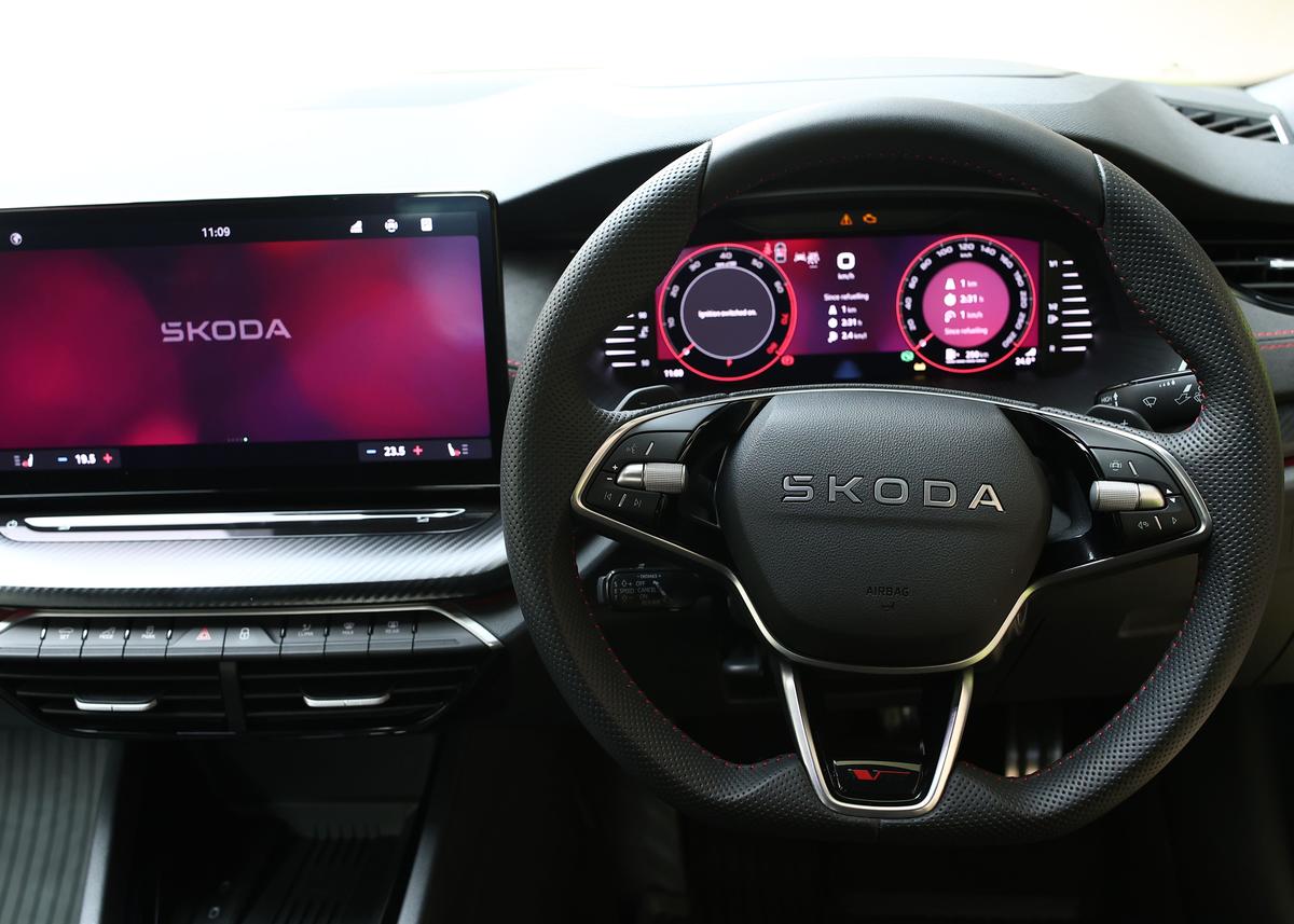 Inside, the RS pairs sporty intent with premium comfort — Suedia seats, red stitching, and cutting-edge tech Inside, the RS pairs sporty intent with premium comfort — Suedia seats, red stitching, and cutting-edge tech