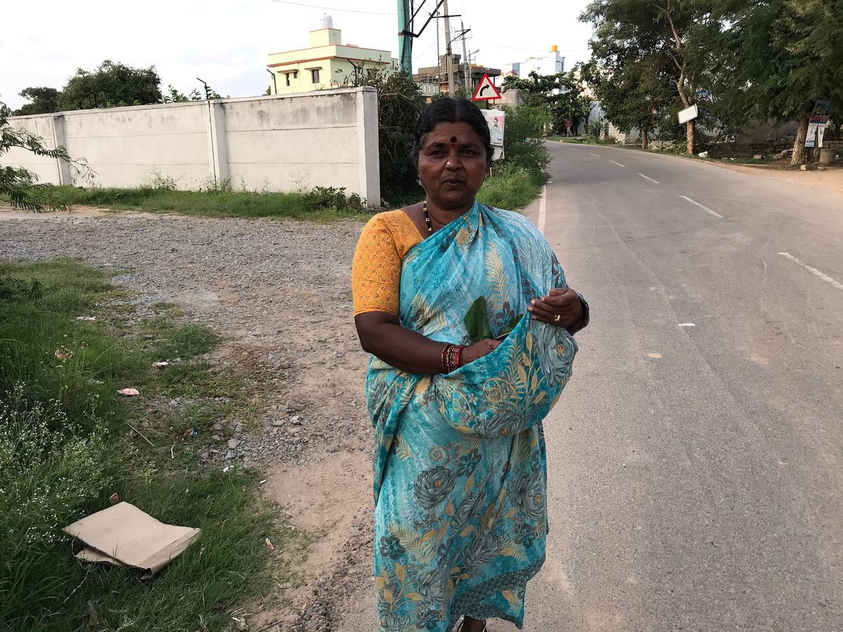 A local in Sarjapur with her foraged herbs