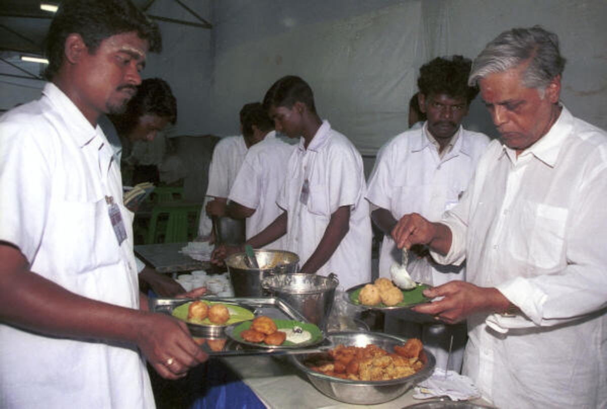 Mani Iyer serving his guests at a sabha canteen in 2003