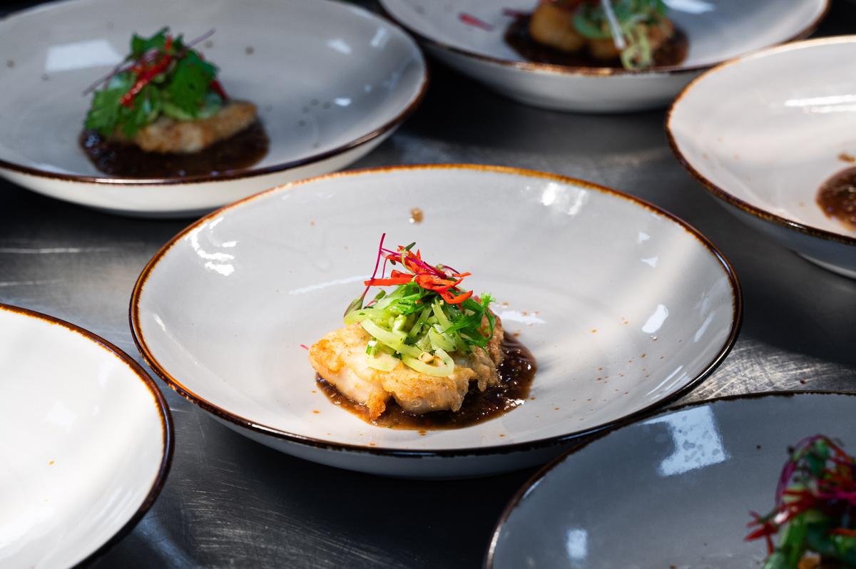 Crispy sweet and sour barramundi with cucumber and fresh herb slaw